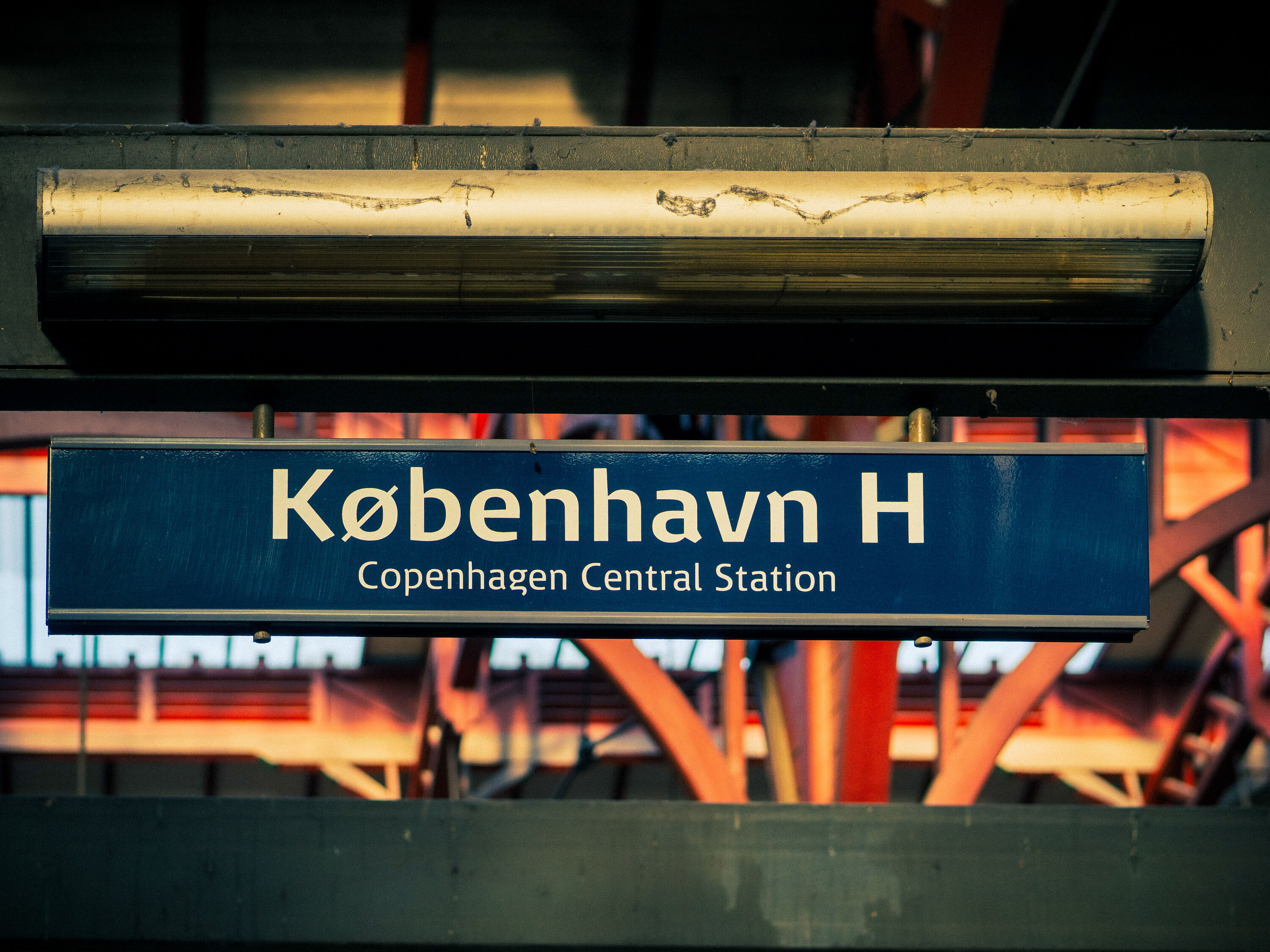 Illuminated København H sign at Copenhagen Central Station, Denmarkan iconic urban landmark and vibrant transit hub for travel, exploration, and city life.