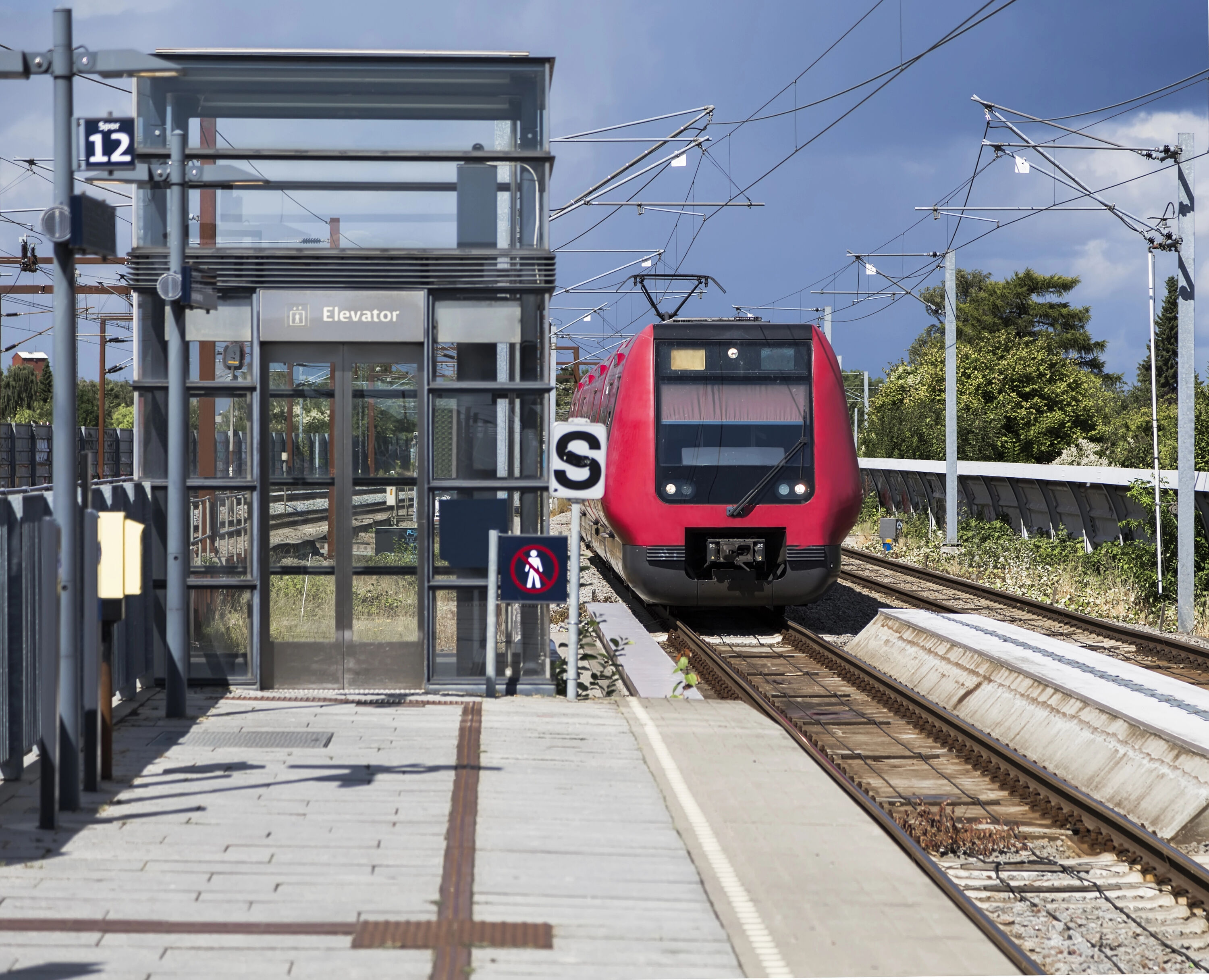 Urban train approaches the platform in Denmark