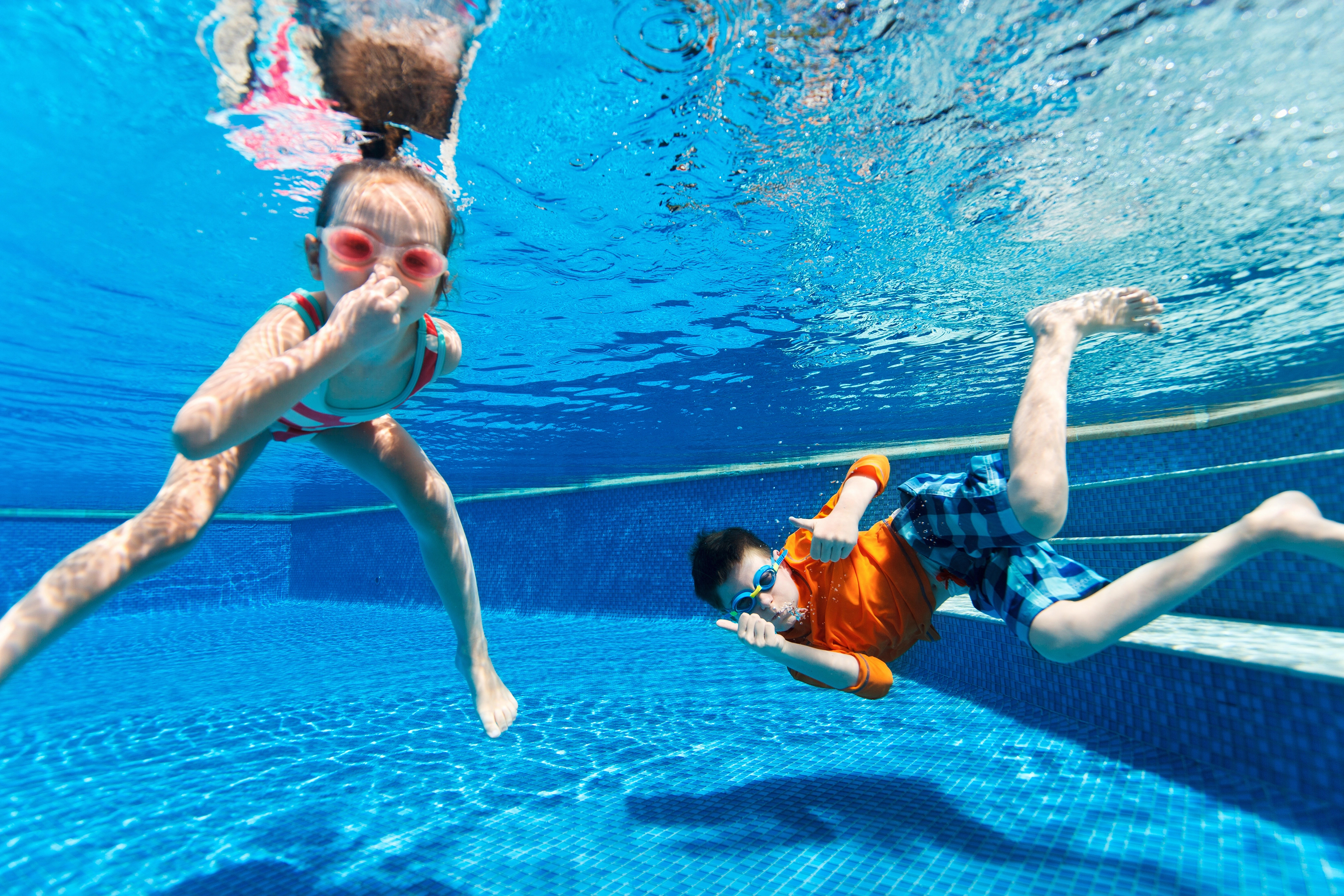 Kids swimming underwater