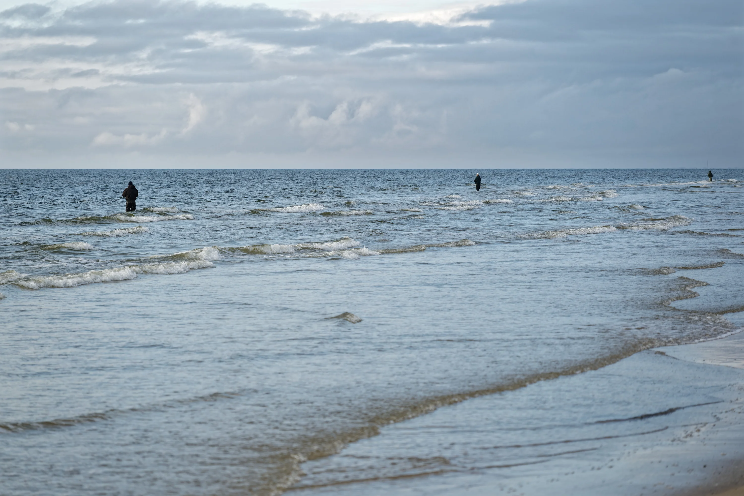 Vissers in de zee bij Grærup